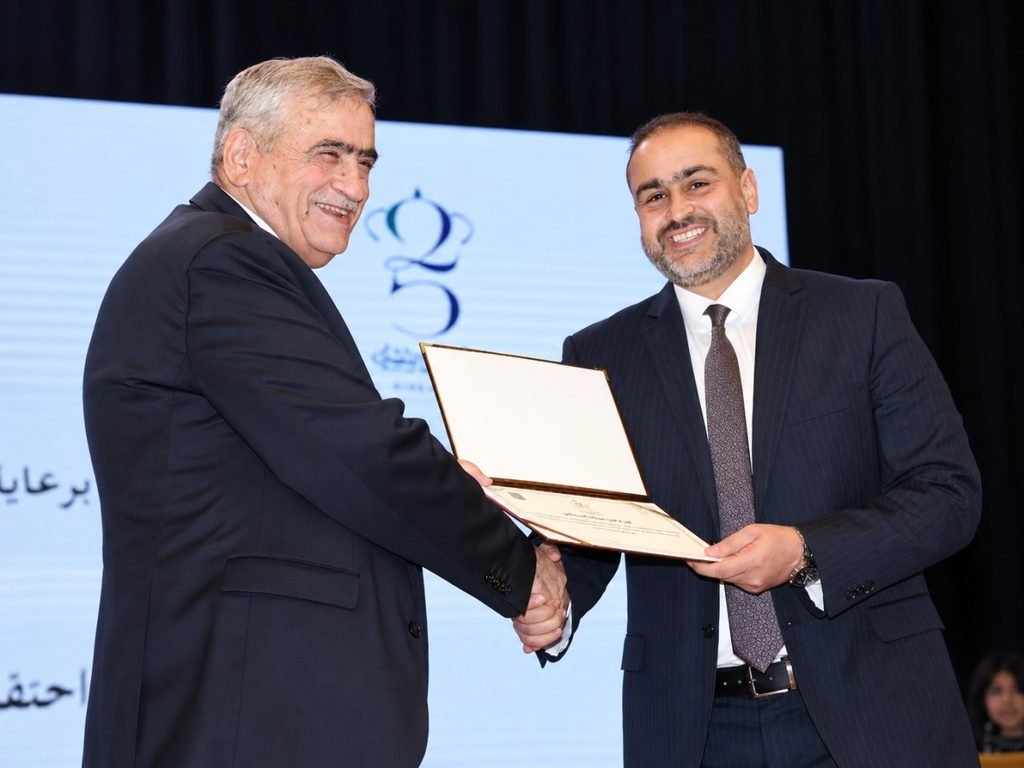 Prof. Dr. Hamzah Al-Mawali during an official recognition ceremony